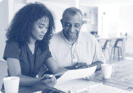 caregiver showing papers to old man