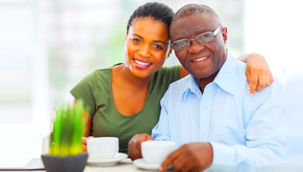 lady and old man in glasses smiling