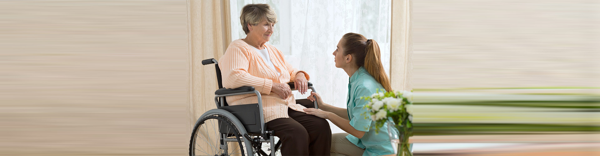 caregiver and senior woman facing each other