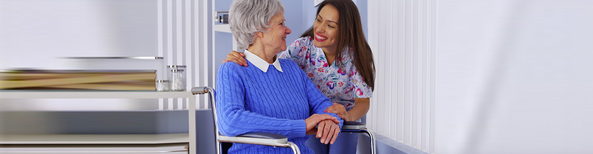 caregiver and old lady in wheelchair