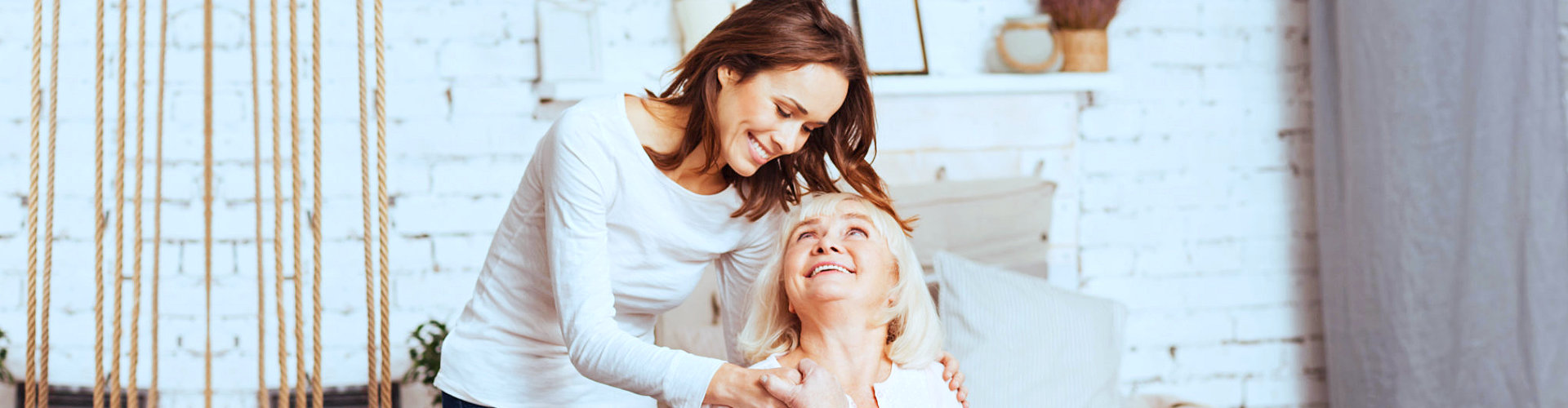 old lady with caregiver behind her